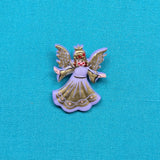 Description: Purple Angel Button with gold embellishments.
Material: Polyester
Type: Shank
Size: 1 inch (25.5 mm)