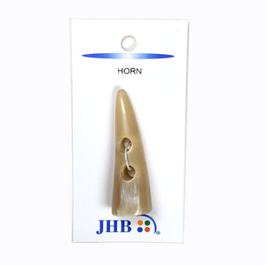 Pointed horn toggle button. Light tan in color. 2 inches